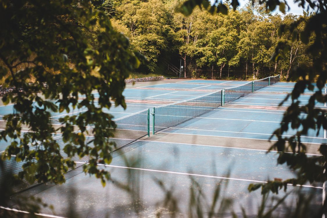 Illustrative tree-lined tennis courts