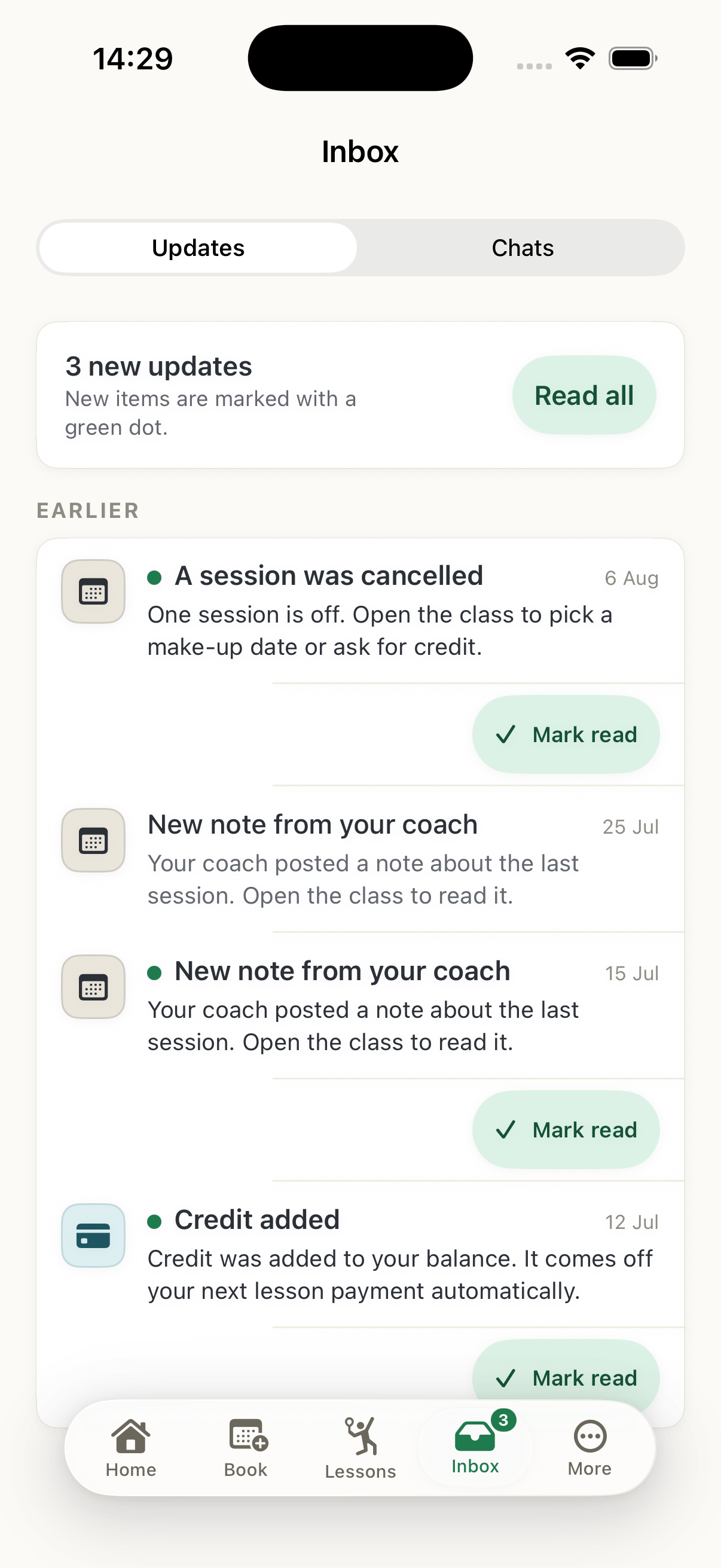 The native iOS app on a household’s phone: the updates inbox — a cancelled session, a coach note and credit added, each carrying its own Mark read
